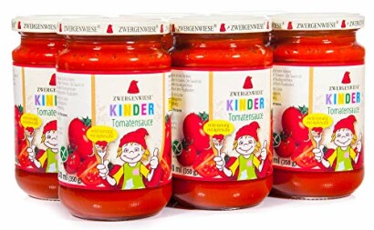 Kinder tomatensaus potten met cartoonfiguur op etiket